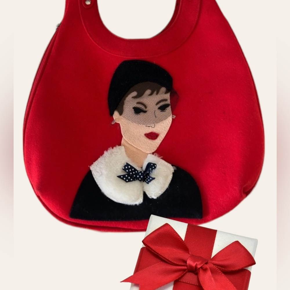 Audrey Hepburn red purse.
